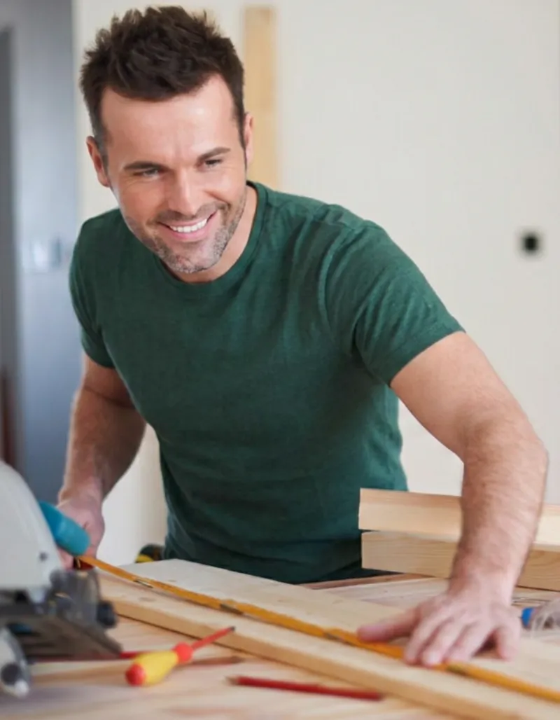 Super Contractor Pro carpenter measuring wood for a Los Angeles remodeling and construction project