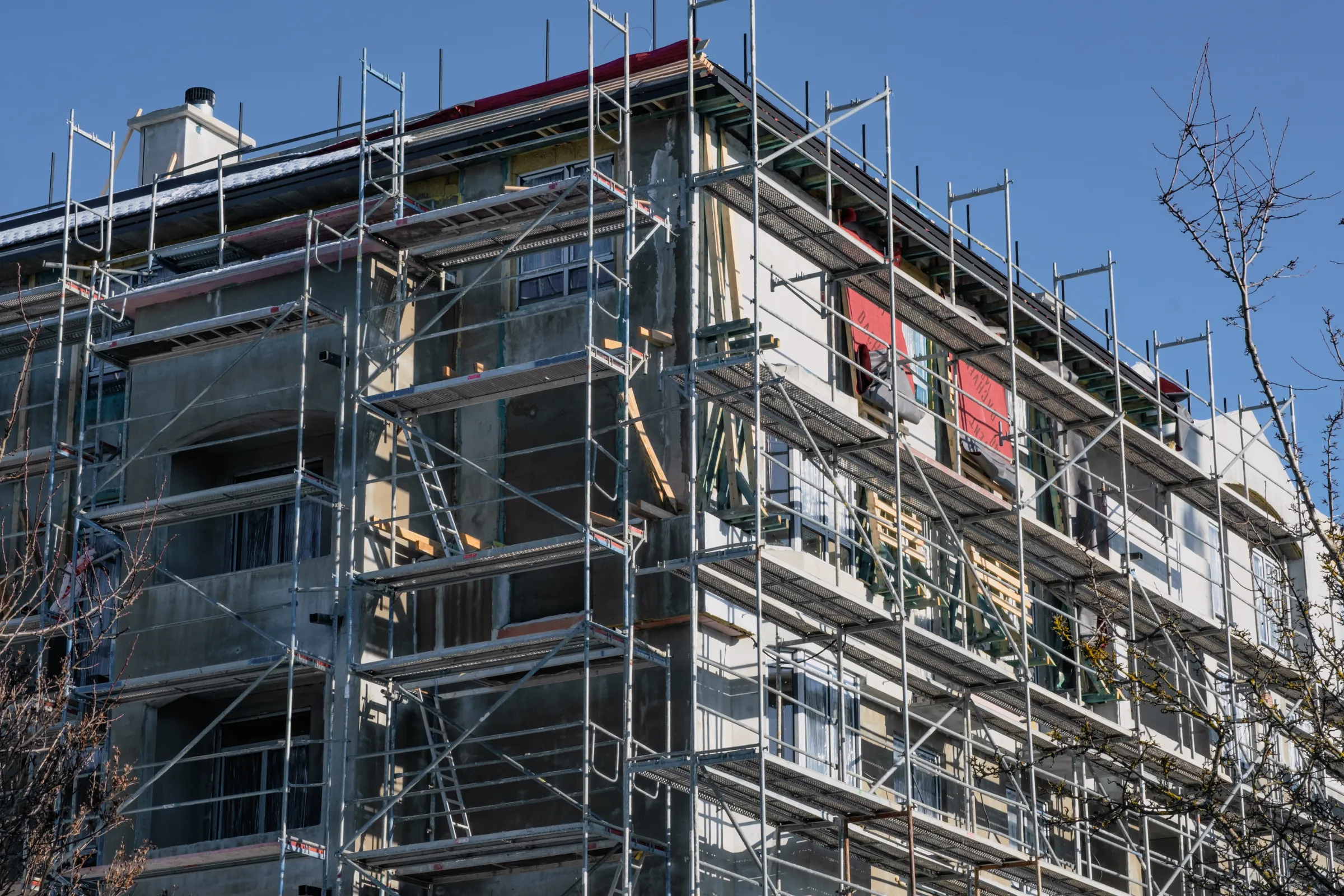 Commercial remodeling in Los Angeles with building exterior renovation, scaffolding, facade upgrades, and construction work in progress