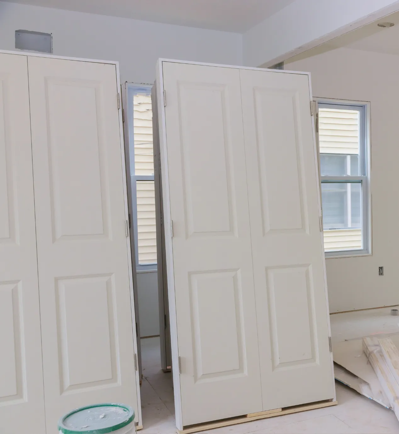 Los Angeles home remodeling project with interior door installation, drywall updates, window openings, and renovation materials on site