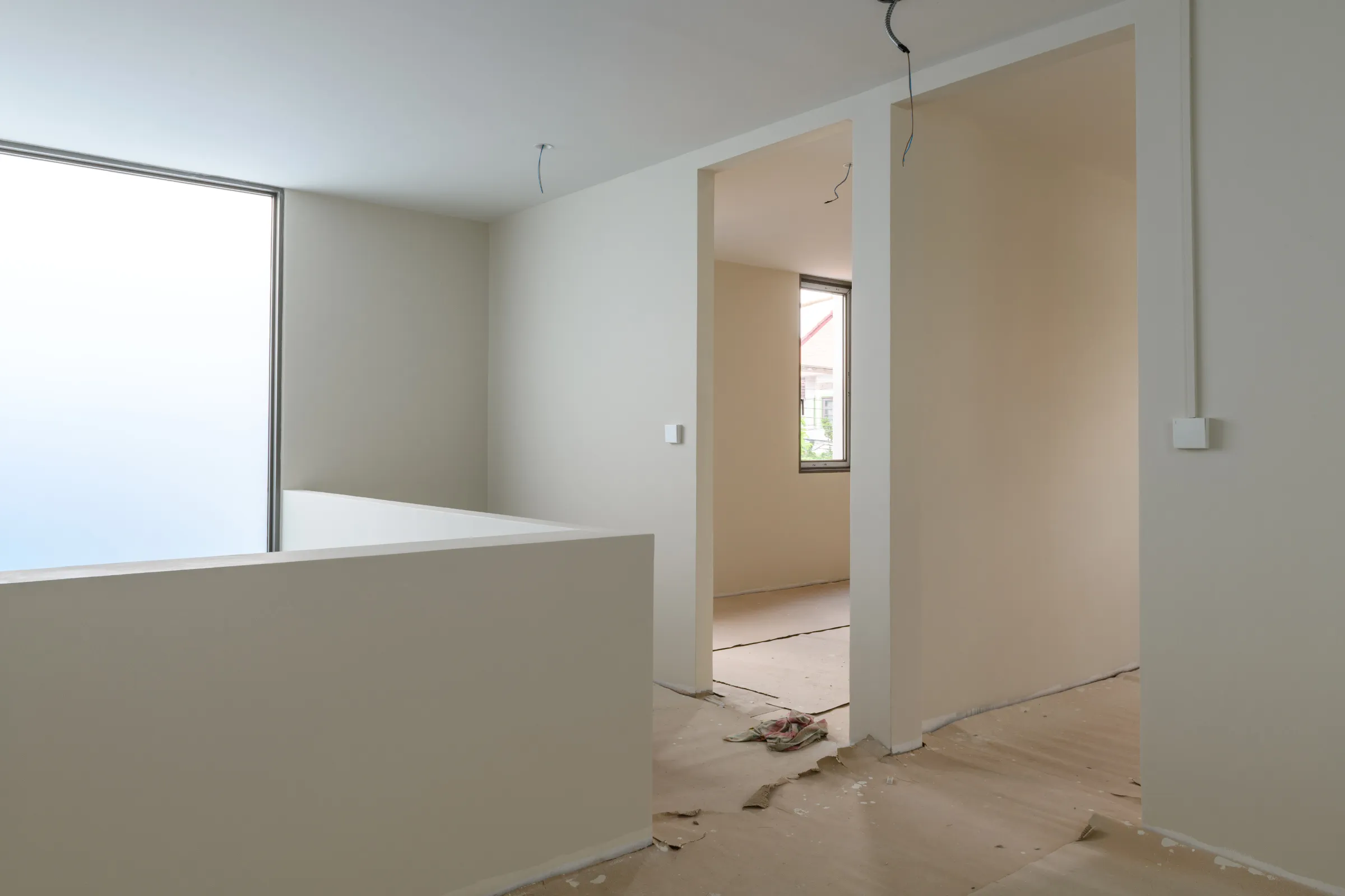 Home remodeling contractor in Los Angeles updating an open interior layout with drywall, electrical planning, and renovation work in progress